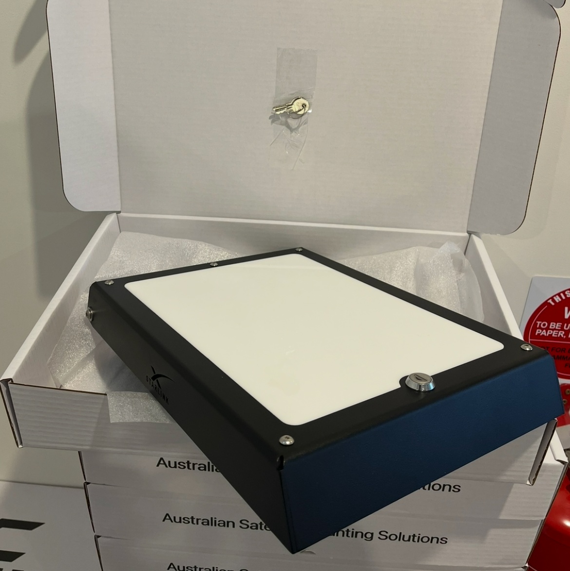 a finished mount boxed for dispatch with the keys taped inside the lid, on a stack of Kettle Customs shipping boxes