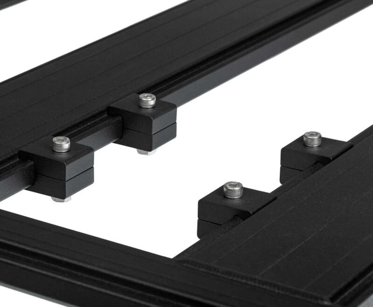 ARB BASE Rack alloy mounting blocks clamped to a rack platform slat with stainless button head fasteners