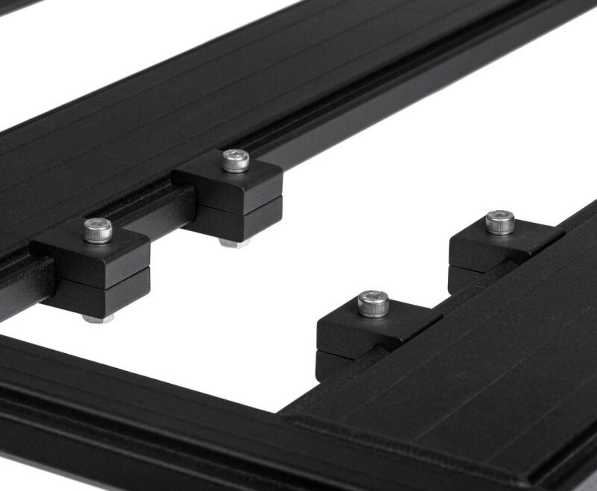 ARB BASE Rack alloy mounting blocks clamped to a rack platform slat with stainless button head fasteners