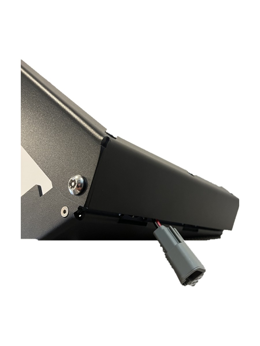 Close-up of the sealed input plug routed out under the back edge of the Power Hub